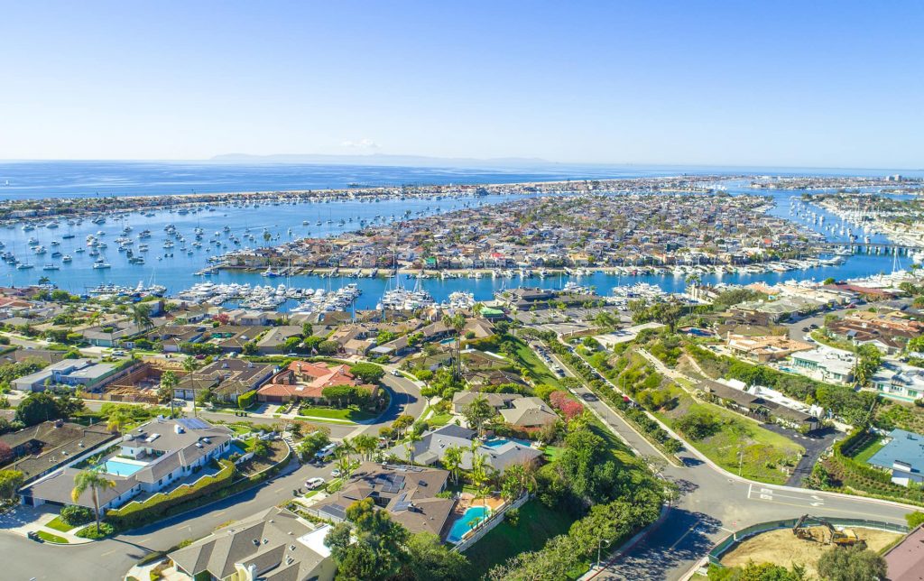 Aerial View Of Newport Beach Including Homes And The Harbor